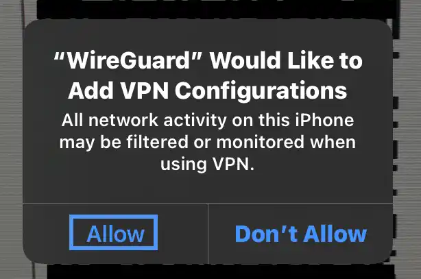 iOS system alert, WireGuard Would Like to Add VPN Configurations, stating that all network activity on this iPhone may be filtered or monitored when using VPN, with Allow button highlighted and Don't Allow option